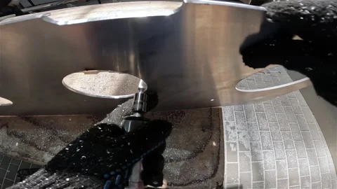 Grinding and processing of an aluminum part, first-person view. Worker operates Stockbeeldmateriaal 337897121