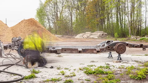 Grinding and sanding the rust off of a car or truck frame - time lapse Stock Footage 236005384