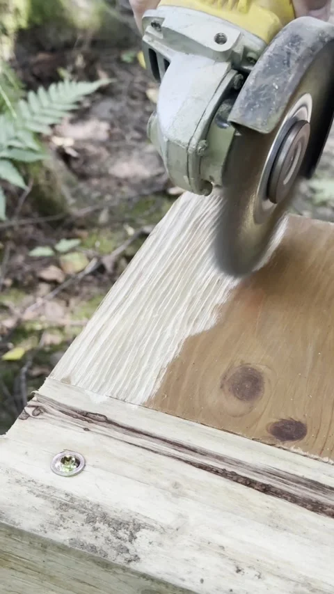 Grinding and Smoothing Wooden Structure With Angle Grinder Stock Footage 342167075