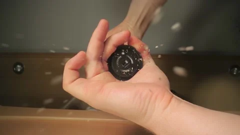 Grinding black pepper in a mill, view from below Stock Footage 130954169