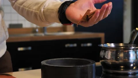 Grinding cinnamon using pestle and mortar Stock Footage 164426911