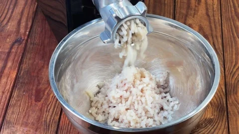 Grinding cod meat into ground fish with electric meat grinder 스톡 동영상 331744462
