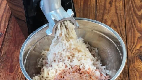 Grinding cod meat into ground fish with electric meat grinder 스톡 동영상 331744509
