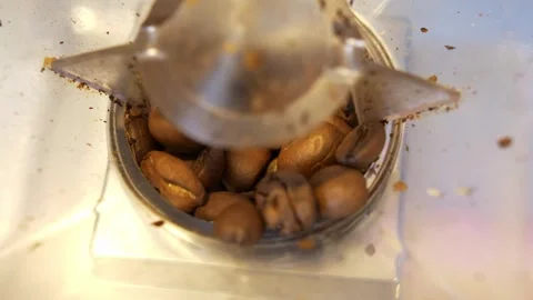 Grinding Coffee Beans in an Electric Grinder – Close-Up Shot Stock Footage 306232169