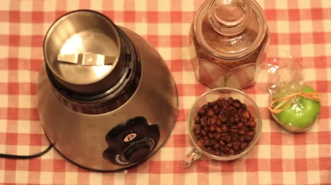 Grinding coffee beans in an electronic coffee grinder Stock Footage 59888401
