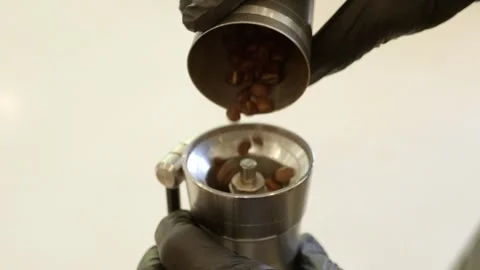 Grinding coffee beans for fresh brew home kitchen tutorial modern close-up 스톡 동영상 302428033