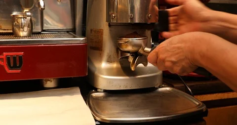 Grinding coffee beans to make espresso coffee Stock Footage 109321311