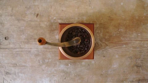 Grinding coffee beans in mill Video stock 74570707