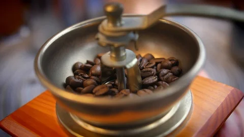 Grinding Coffee Beans in Old Manual Grinder Close-up Slow Motion Video stock 118535214
