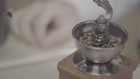 Grinding coffee in coffee mill horizontal, vintage coffee grinder  Stock Footage 120492304