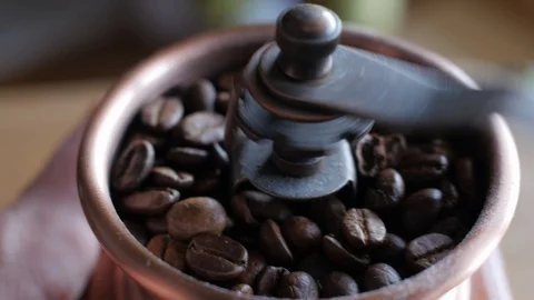 Grinding coffee in a hand mill Stock-Footage 87496768