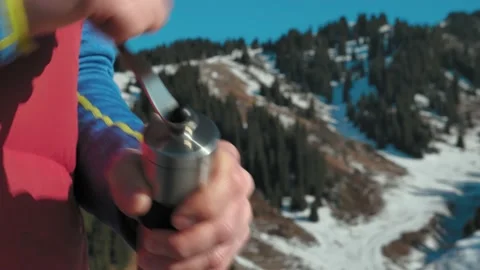 Grinding coffee in a manual coffee grinder in winter in the mountains Stock Footage 144094872