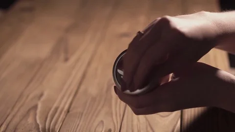 Grinding cones of marijuana with a grinder close-up. Weed buds and grinder in 스톡 동영상 83047791