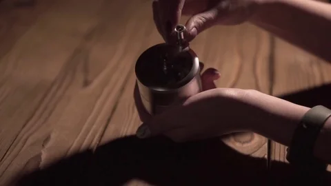 Grinding cones of marijuana with a grinder close-up. Weed buds and grinder in 스톡 동영상 83050159