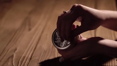 Grinding cones of marijuana with a grinder close-up. Weed buds and grinder in 스톡 동영상 83050254
