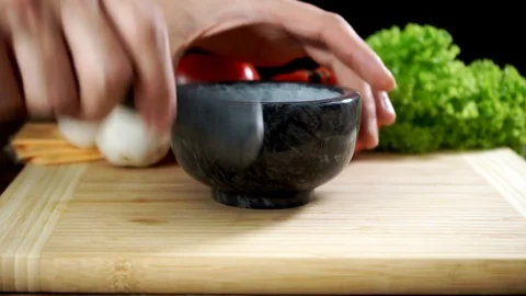 Grinding different spices in a mortar. Cooking. Stock Footage 125553948