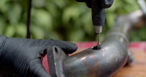 Grinding the edge of a pipe to widen the hole and make space for welding an O2. Stock Footage 313495030