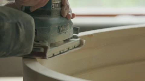 Grinding instrument removing the outer layer of timber material from the detail Stock Footage 233168712