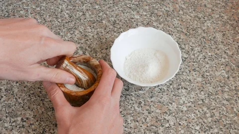 Grinding of large sea salt Stock Footage 104883359