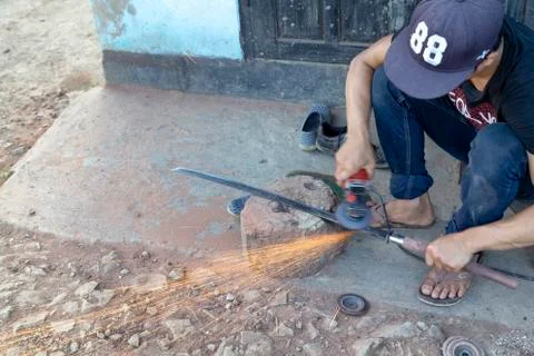 Grinding a long sword Stock Photos