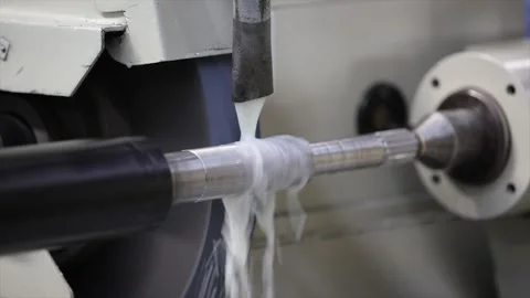 A grinding machine in operation, showing the intense coolant during a metal Video stock 328083244