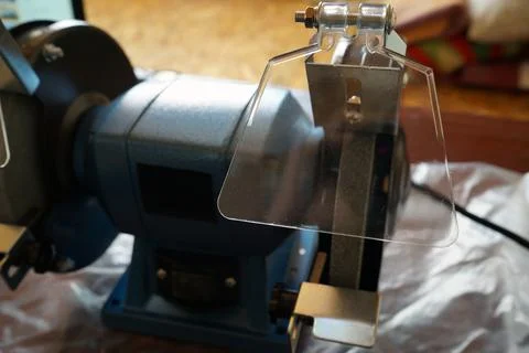 Grinding machine. Sharpening machine for edge tools. A new machine for sharpe Stock Photos