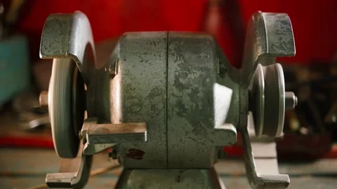 The grinding machine with two grinding discs stops. Malfunctions in the Stock Footage 229863980