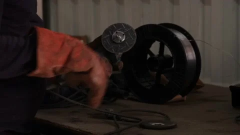 Grinding machine, worker attaches the stone of the grinding machine in workshop Stock Footage 163708888