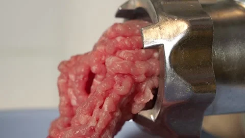 Grinding meat using an electric meat grinder. Stock Footage 257122499