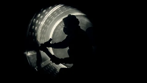 Grinding a metal barrel from the middle Stock Footage 124635377