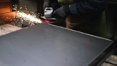 Grinding metal with a grinder. Super slow motion 240 fps Stock Footage 153578244