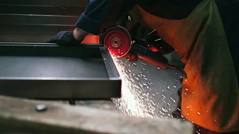 Grinding metal with a grinder. Super slow motion 240 fps Stock Footage 153579534