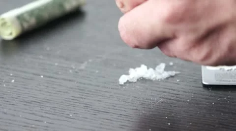 Grinding up the methamphetamine crystals HD Stock Footage 8993529