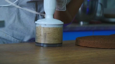 Grinding nuts for cream Stock Footage 75516474