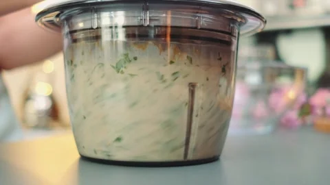 Grinding oatmeal, spinach and greens in a blender Stock Footage 252246728