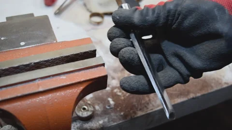 Grinding an old chisel on disks in the workshop. Stock Footage 155884730