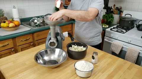 Grinding or processing boiled potatoes to be used with flour and egg Stock Footage 160433454