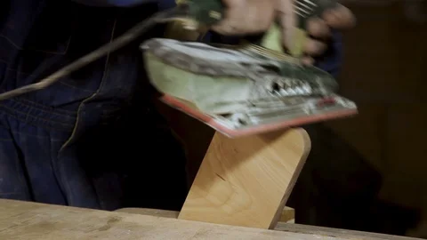 Grinding a piece of wood in the carpentry workshop close-up. Accelerated time Vidéo 100806395