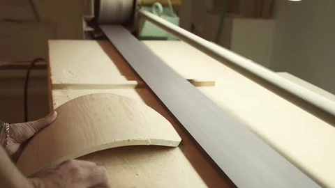 Grinding a piece of wood on a machine Video stock 128369645