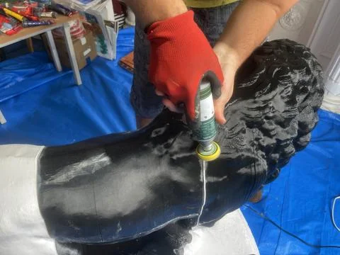 Grinding plastic with a drill. handmade work statue Lion Medici Stock Photos