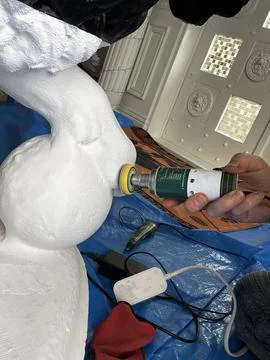 Grinding plastic with a drill. handmade work statue Lion Medici Stock Photos