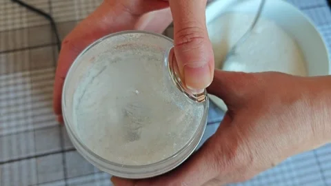 Grinding , powdered sugar in a coffee grinder 動画素材 346457644