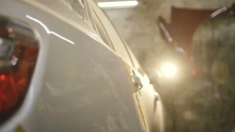 The grinding primered car surface with grind machine. 4K Stock Footage 86829052