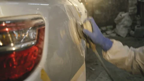 The grinding primered car surface with grind machine. 4K Stock-Footage 86829167