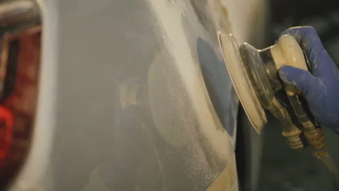 The grinding primered car surface with grind machine. 4K Stock-Footage 86829170