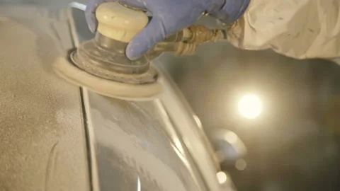 The grinding primered car surface with grind machine. 4K Vidéo 86829311