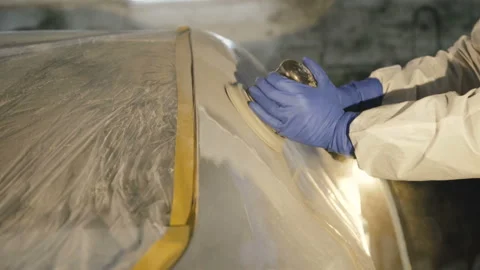 The grinding primered car surface with grind machine. 4K Video stock 86829801