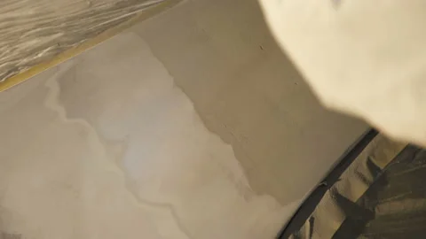 The grinding primered car surface with grind machine. 4K Stock Footage 86829855