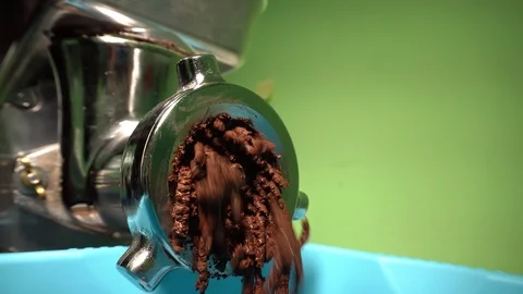 Grinding process. Cocoa nibs are ground into cocoa mass. Stock Footage 88953744