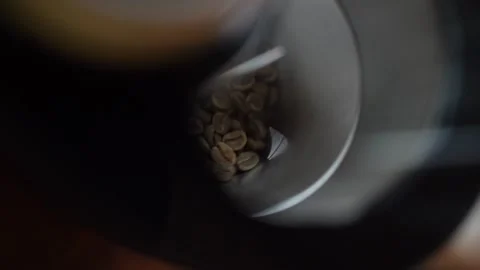 Grinding Roasted Coffee Beans In Burr Grinder - Table Top View Stock Footage 252610715